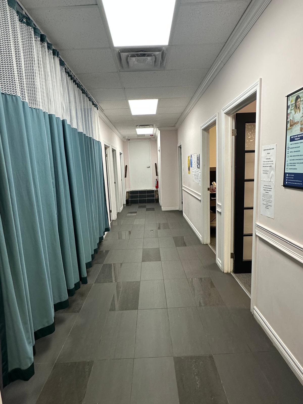 Clean patient hallway with treatment bays