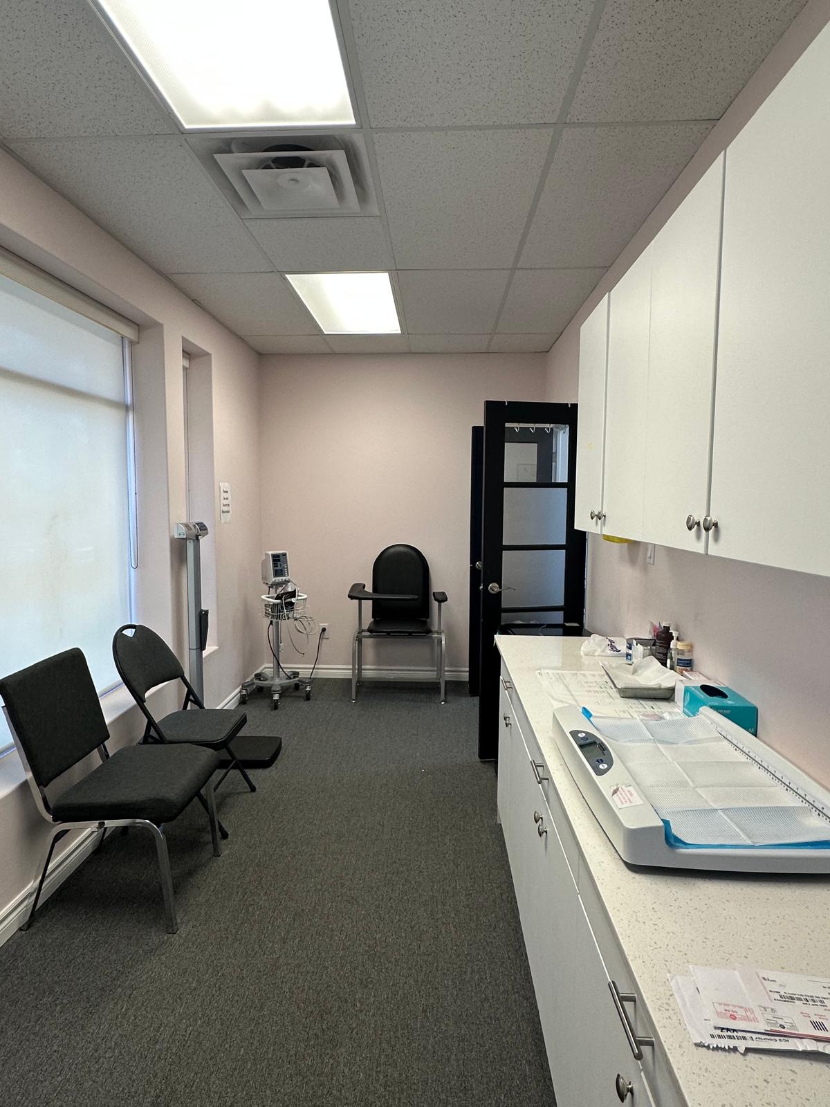 Procedure and vitals room with weighing and monitoring equipment